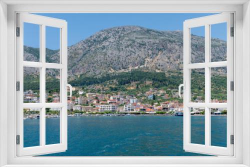 Fototapeta Naklejka Na Ścianę Okno 3D - Ionian Sea, Greece-05.24.2022. A general view from the sea of the port town of Astakos on the Greek Ionian coast.