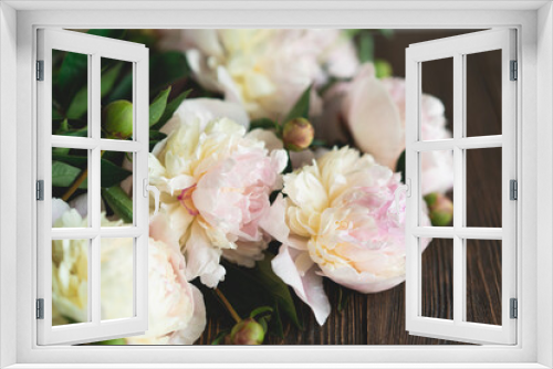 Fototapeta Naklejka Na Ścianę Okno 3D - Bouquet white pink peonies flowers on a wooden background. Flat lay minimalist aesthetic peonies. Beautiful card for Mother's Day or Women's Day