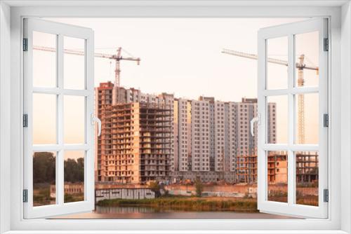 Fototapeta Naklejka Na Ścianę Okno 3D - Kazan, Russia - June 8, 2021: Construction crane and a building house