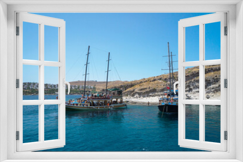 Fototapeta Naklejka Na Ścianę Okno 3D - Pleasure yachts for tourists in the Mediterranean or Aegean Sea in Turkey against the backdrop of a city with white houses on a hill, Turkey