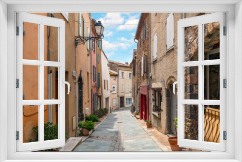 Fototapeta Naklejka Na Ścianę Okno 3D - A charming, picturesque street in the medieval village of Grimaud, France, in the hills above Saint-Tropez along the French Riviera.