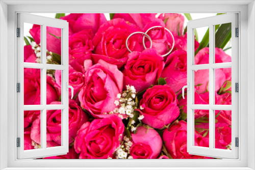 Fototapeta Naklejka Na Ścianę Okno 3D - wedding rings and bridal bouquet of pink roses isolated over whi