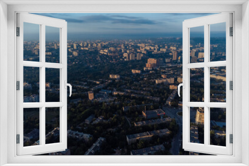 Fototapeta Naklejka Na Ścianę Okno 3D - Sunny morning view in summer green city, residential district. Aerial cityscape above buildings and streets, Pavlovo Pole, Kharkiv Ukraine