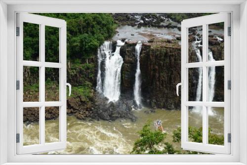 Fototapeta Naklejka Na Ścianę Okno 3D - The photo shows a beautiful view of the Iguazu Falls, which are located on the border between Brazil and Argentina.