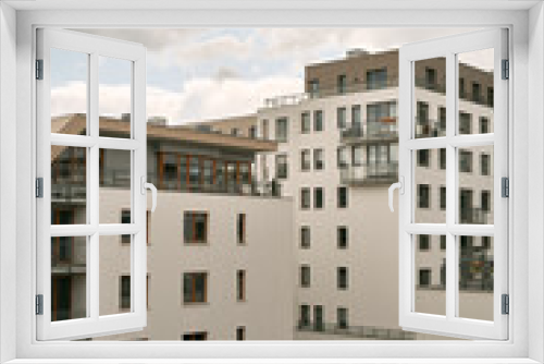 Fototapeta Naklejka Na Ścianę Okno 3D - Modern low-rise apartment building. Condominium with white facades and windows