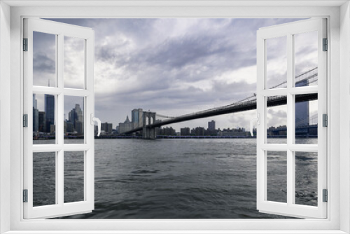 Fototapeta Naklejka Na Ścianę Okno 3D - View of Manhattan and the Brooklyn Bridge from Brooklyn in New York City