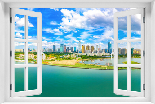 Fototapeta Naklejka Na Ścianę Okno 3D - Haikou City Skyline Panoramic View in the Coastal CBD Area, the Capital City of Hainan Province, the Largest Pilot Free Trade Zone and Tourism Destination in China. 