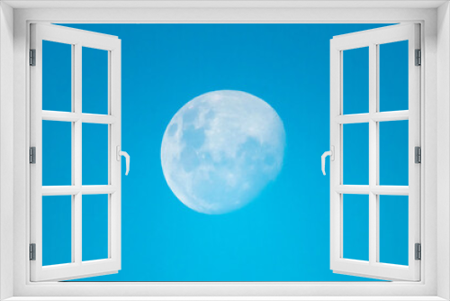 Fototapeta Naklejka Na Ścianę Okno 3D - 87 percent moon rising in the later afternoon blue sky