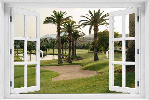 Fototapeta Naklejka Na Ścianę Okno 3D - Golf course views at sunset