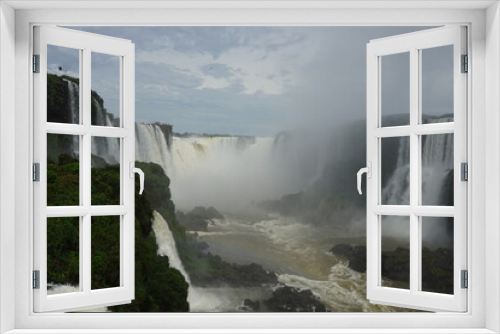 Fototapeta Naklejka Na Ścianę Okno 3D - The photo shows a stunning landscape at the Iguazu Falls located on the border of Brazil (Paraná state) and Argentina (Misiones province)