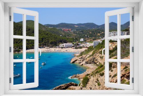 Fototapeta Naklejka Na Ścianę Okno 3D - Cala Llonga bay on the southern side of Ibiza in the Balearic islands in the Mediterranean Sea - Cove with turquoise waters surrounded with pine covered hills