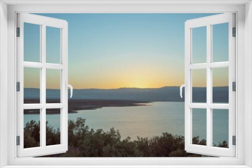 Fototapeta Naklejka Na Ścianę Okno 3D - Orange sunrise reflecting off of the Dead Sea. High quality photo