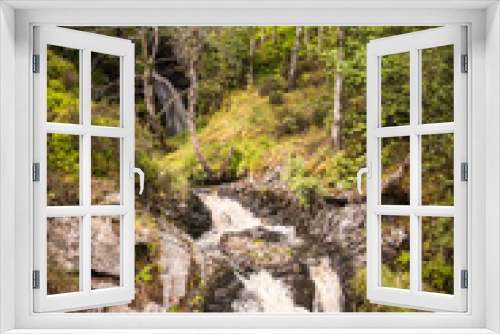 Fototapeta Naklejka Na Ścianę Okno 3D - A bright, summer HDR image of Allt na h-annaite, a waterfall along Strathconon in Ross-shire, Scotland