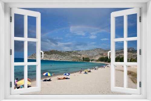 Fototapeta Naklejka Na Ścianę Okno 3D - People at the beach in the  Peloponese in greece