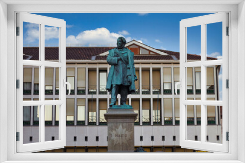 Venice, Italy - September 04, 2018: Daniele Manin bronze statue in a main square against beautiful building and blue sky during afternoon