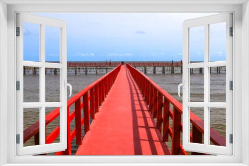 Fototapeta Naklejka Na Ścianę Okno 3D - Red Boardwalk Bridge near Matchanu Shrine,Phanthai Norasing,Samut Sakhon,Thailand.