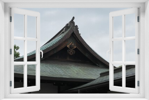 Fototapeta Naklejka Na Ścianę Okno 3D - Old traditional temple architecture of Japan, rustic “Gegyo” decor and the “Omune” on the top of the roof, cloudy sky year 2022 June 23rd at “Kiyomizu Kannon-do” Tokyo Japan