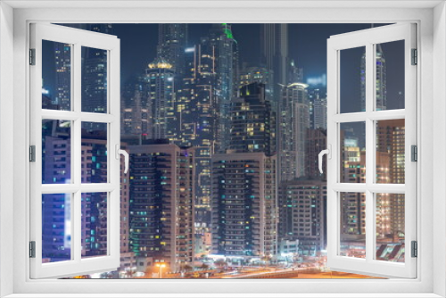 Fototapeta Naklejka Na Ścianę Okno 3D - Dubai marina tallest block of skyscrapers night timelapse.