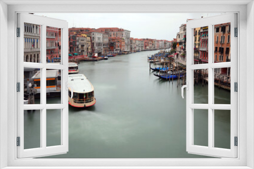 Fototapeta Naklejka Na Ścianę Okno 3D - unusual view from the Rialto Bridge in Venice with very few boats and no people with the effect of the long time of photographic exposure during the lockdown in Italy