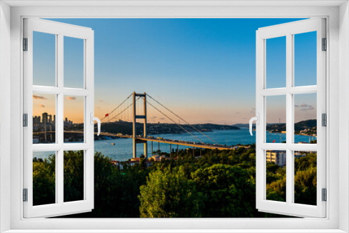 Fototapeta Naklejka Na Ścianę Okno 3D - ISTANBUL, TURKEY. Panoramic view of Istanbul Bosphorus on sunset. Istanbul Bosphorus Bridge (15 July Martyrs Bridge. Turkish: 15 Temmuz Sehitler Koprusu). Beautiful cloudy blue sky.