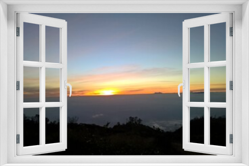 Fototapeta Naklejka Na Ścianę Okno 3D - Early morning looking over beautiful golden sunrise Premium Photo
