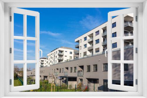 Fototapeta Naklejka Na Ścianę Okno 3D - new european modern complex beautiful apartment house flat building mortage on sunset cloud