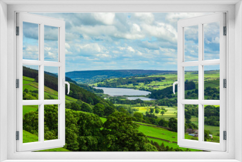 Fototapeta Naklejka Na Ścianę Okno 3D - Gouthwaite Reservoir in Nidderdale, an area of outstanding natural beauty in Summertime with lush green fields, forests and livestock.  Yorkshire Dales, UK.  Copy space.