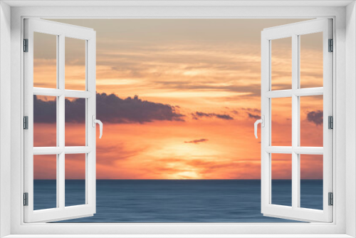 Fototapeta Naklejka Na Ścianę Okno 3D - Beautiful colorful dramatic deep vibrant sunset over ocean landscape image