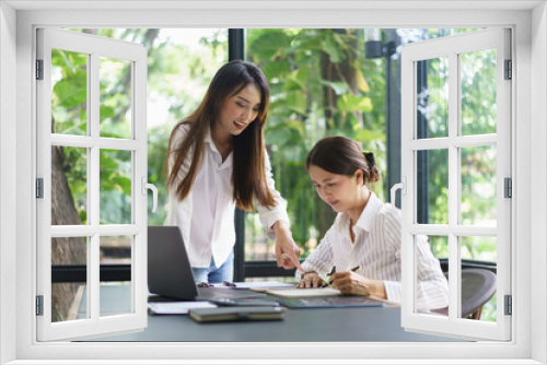 Coworker business concept, Businesswoman discussing project together and writing data on notebook