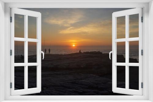 Fototapeta Naklejka Na Ścianę Okno 3D - Early morning sunrise on the south coast of South Africa in Margate with people catching fish