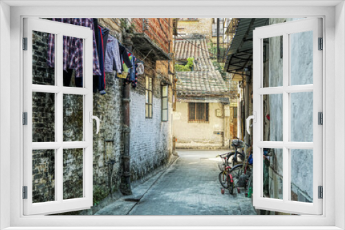 Fototapeta Naklejka Na Ścianę Okno 3D - Around hutongs in Foshan, Guangdong, China, which are a type of narrow streets or alleys in typical neighborhoods with old houses. 