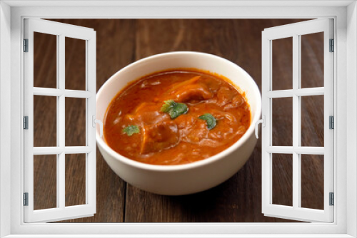 Fototapeta Naklejka Na Ścianę Okno 3D - Indian chicken curry roux like tomato soup on the table