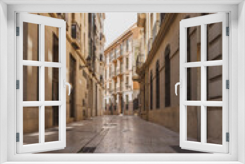 Fototapeta Naklejka Na Ścianę Okno 3D - View of a narrow street in the center of Valencia