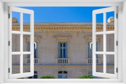 Fototapeta Naklejka Na Ścianę Okno 3D - Liberty, Equality, Fraternity: the national motto of the French Republic inscribed on the facade of an ancient public building in Montpellier, France