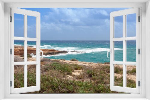 Fototapeta Naklejka Na Ścianę Okno 3D - A view on stormy sea and cliffs on the shore of Cyprus
