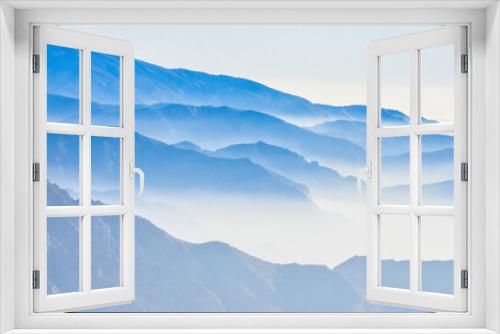 Fototapeta Naklejka Na Ścianę Okno 3D - Foggy morning mountain view landscape shot