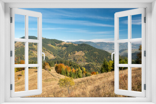 Fototapeta Naklejka Na Ścianę Okno 3D - Stunning sunny morning scene. Beautiful view of Carpathian mountain scenery with autumn meadows and trees in beautiful sunny day with blue sky