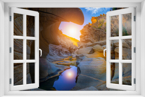 Fototapeta Naklejka Na Ścianę Okno 3D - Tasyaran canyon, which attracts attention with its rock shapes similar to Antelope canyon in Arizona, offers a magnificent view to its visitors. Canyon view and stream at sunset, Usak, Turkey.