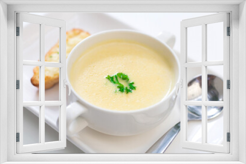 Fototapeta Naklejka Na Ścianę Okno 3D - Delicious corn soup In a white bowl served with bread.