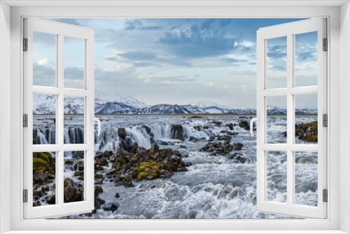 Fototapeta Naklejka Na Ścianę Okno 3D - Season changing in southern Highlands of Iceland. Picturesque waterfal Tungnaarfellsfoss panoramic autumn view.  Landmannalaugar mountains under snow cover in far.