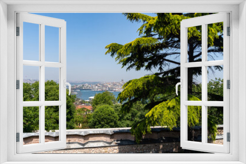 Fototapeta Naklejka Na Ścianę Okno 3D - View of Istanbul from Topkapi Palace, with some trees in front, and on a sunny day.