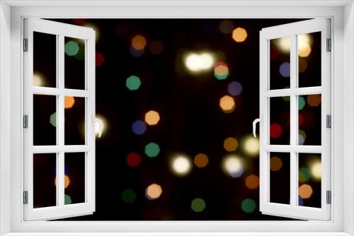 multicolored festive lights on a black background screensaver backdrop