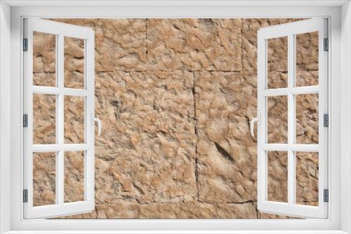 Fototapeta Naklejka Na Ścianę Okno 3D - Masonry walls of natural sand color. Stone texture close-up, construction and mining background.