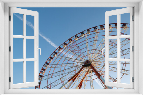 Fototapeta Naklejka Na Ścianę Okno 3D - ferris wheel on a blue sky