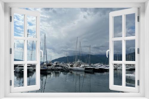 Fototapeta Naklejka Na Ścianę Okno 3D - Sailing yachts stand at the pier against the backdrop of the mountains