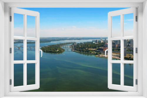 Fototapeta Naklejka Na Ścianę Okno 3D - Beautiful summer landscape over the river with view to the downtown. Beautiful  urban environment - drone shooting.  Aerial view on a urban environment Dnepr city.
