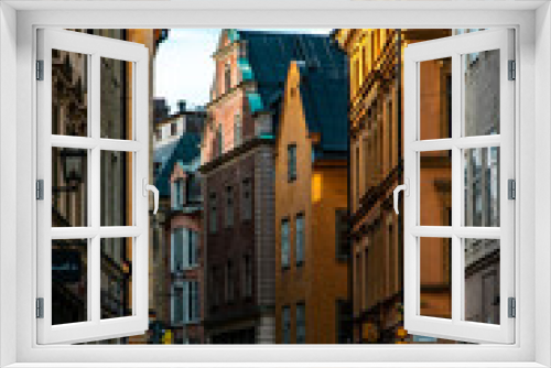 Fototapeta Naklejka Na Ścianę Okno 3D - Empty Swedish Street with Yellow Buildings