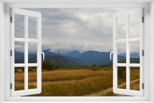 Fototapeta Naklejka Na Ścianę Okno 3D - Transfegerash panoramic view of the mountains in the clouds