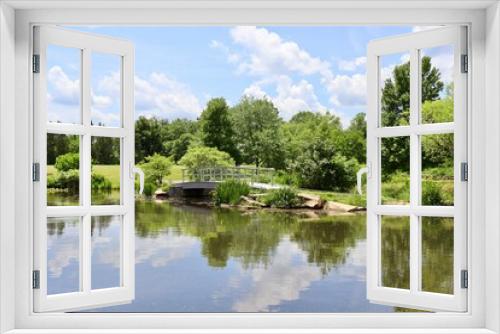 Fototapeta Naklejka Na Ścianę Okno 3D - The wood bridge over the pond in the countryside.