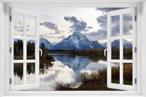 Fototapeta Naklejka Na Ścianę Okno 3D - River surrounded by Trees and Mountains in American Landscape. Snake River, Oxbow Bend. Spring Season. Grand Teton National Park. Wyoming, United States. Nature Background.